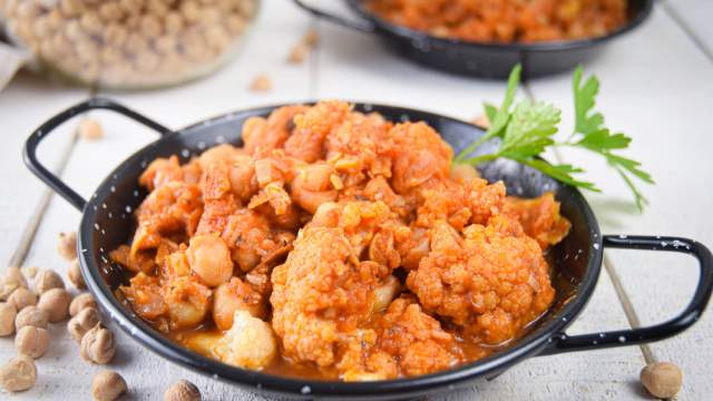 Slow cooker chickpea masala with cauliflower in tomato sauce with Indian spices and cilantro.