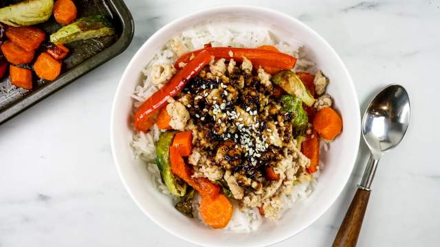 Asian rice bowls with white rice, vegtables, ground turkey, and soy sauce.