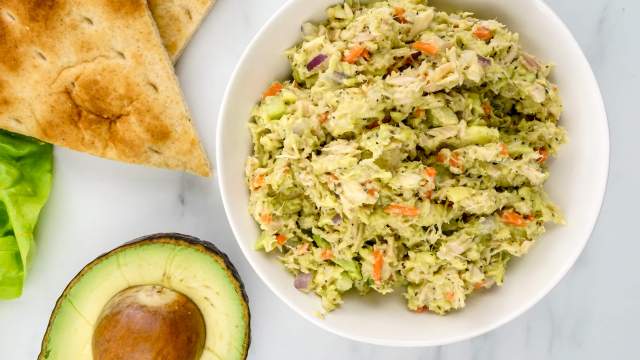 Avocado tuna salad with red onion, celery, and carrots.