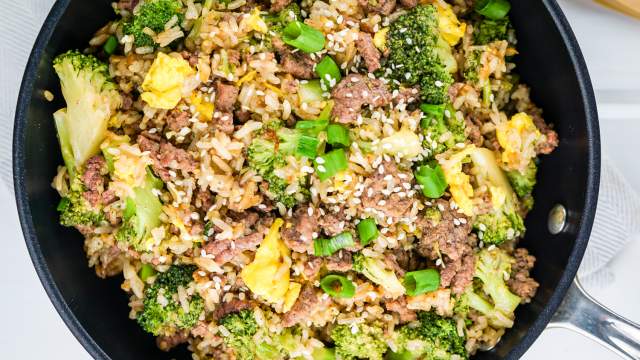 Beef and broccoli fried rice with eggs in a skillet.