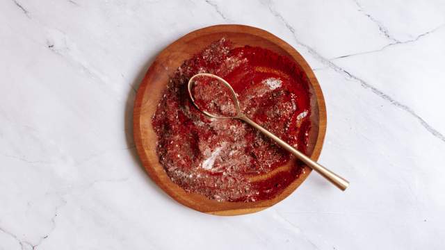 Blackening seasoning on a wooden plate with paprika, garlic powder, oregano, and more.