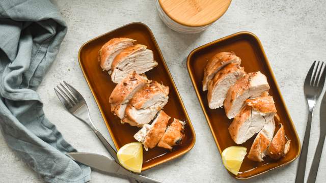 Browns sugar garlic chicken breasts sliced on a plate with a crispy brown sugar topping.