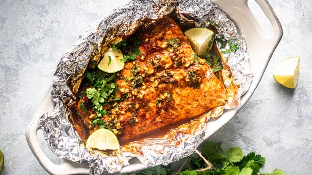 Cilantro lime salmon cooked in foil with garlic, lime juice, cilantro, and honey.