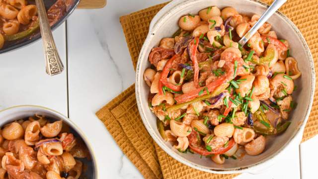 Creamy Cajun Chicken Pasta with peppers, onions, chicken breast, and a creamy cajun sauce in a bowl.