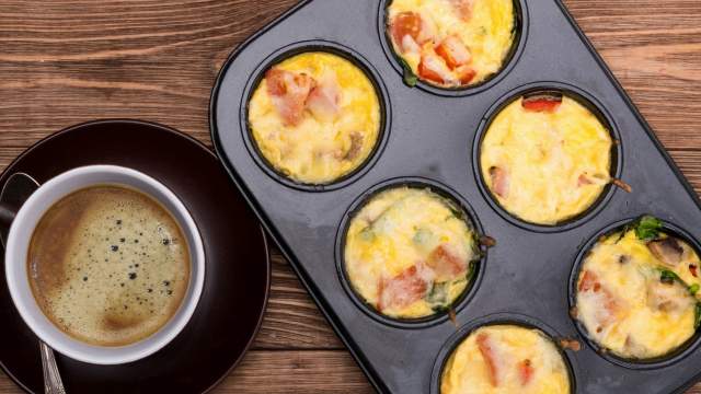 Egg Muffins with ham and cheese in a muffin tin.