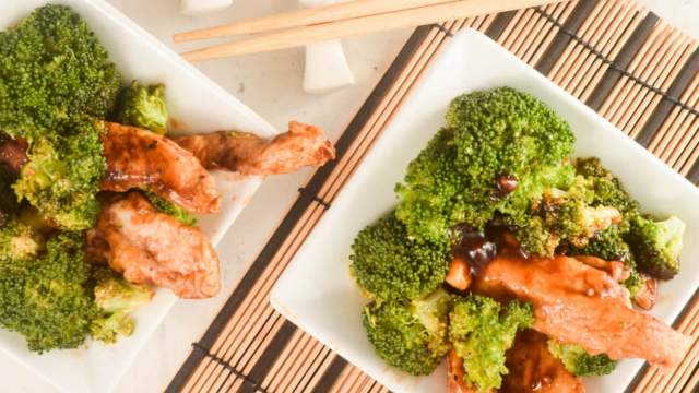 General Tso's Chicken and Broccoli in two bowls with chopsticks.