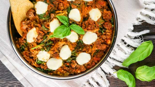 Spaghetti squash casserole with tomatoes, ground beef, and fresh mozzarella cheese.