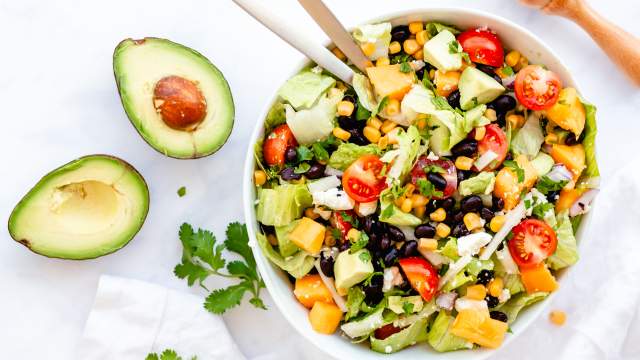 Mexican chopped salad with black beans, corn, avocado, and Mexican dressing.