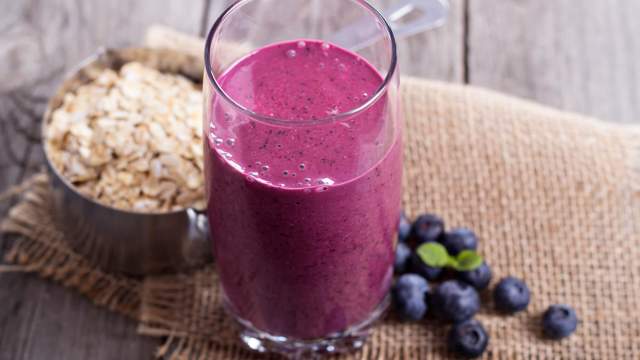 Oatmeal smoothies made with blueberries in a glass. 