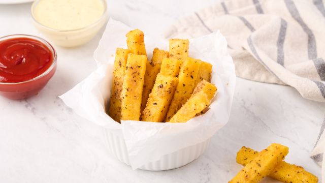 Polenta fries baked with Parmesan cheese and Italian seasoning served with ketchup on the side.