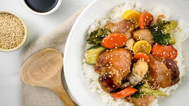 Slow Cooker Chicken Teriyaki and Vegetables with rice and chopsticks.