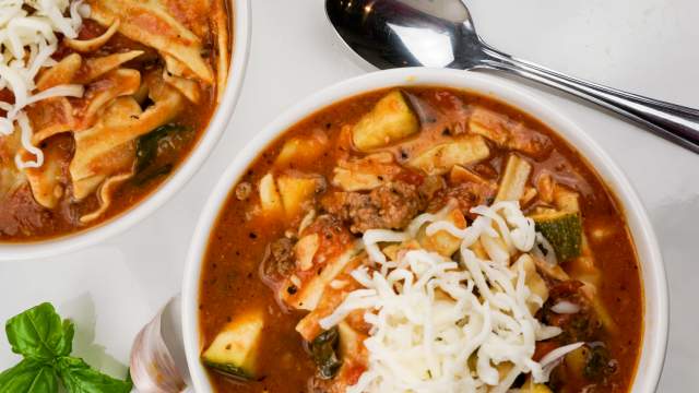 Slow Cooker lasagna soup in a crockpot with noodles, beef, and zucchini.