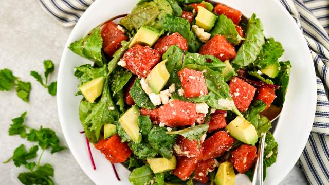 Watermelon avocado salad with cilantro and onions in a honey lime dressing.