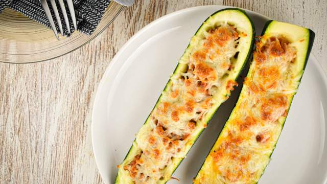 Zucchini and Ground Turkey Pizza Boats in a glass baking dish.